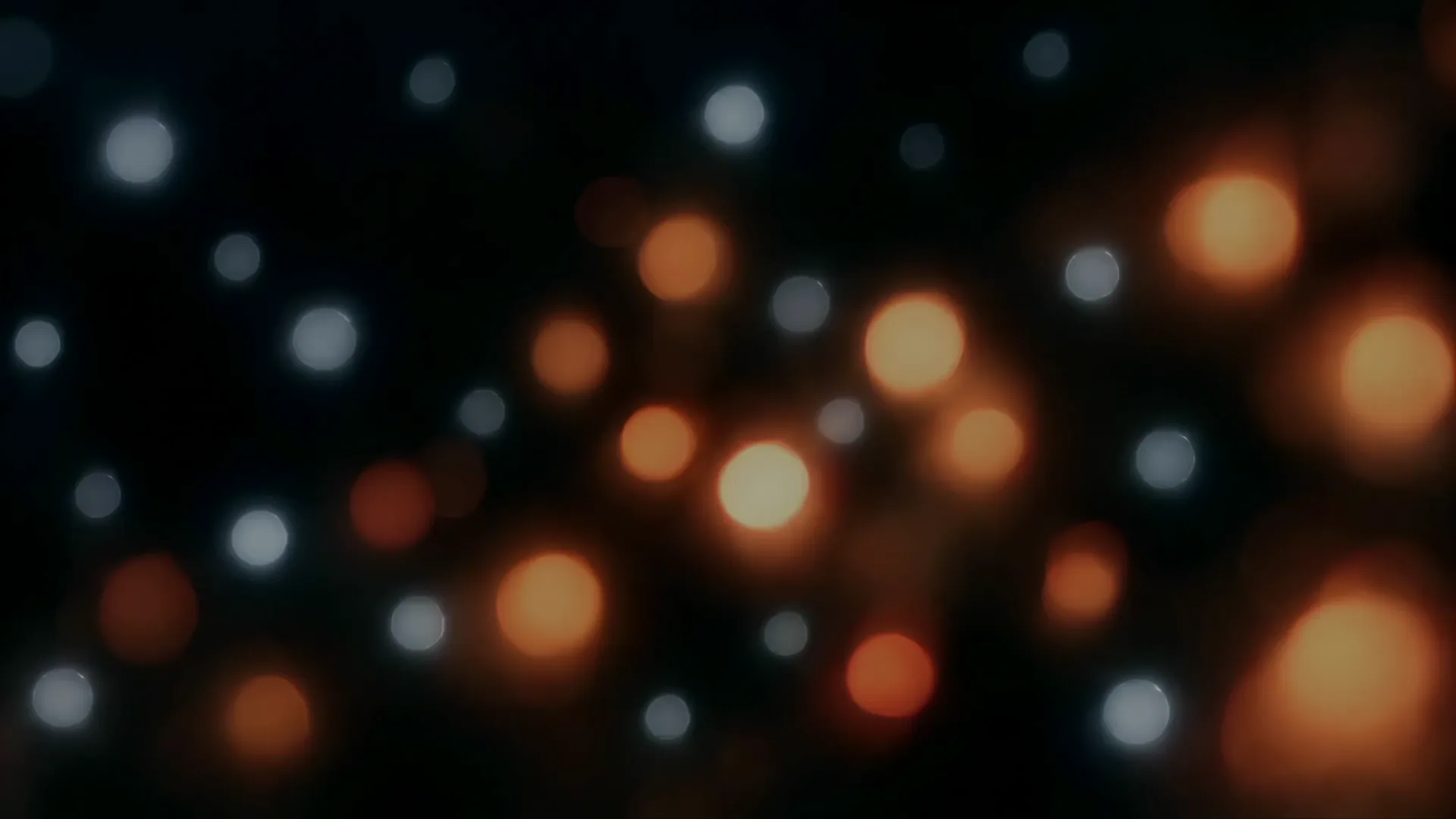 First frame of the loop: a field of points of light, part of it glowing ember.